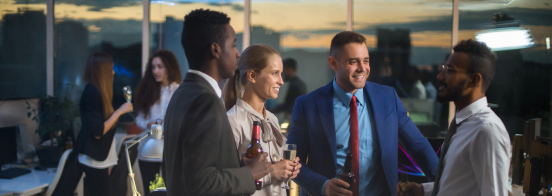 a group of people holding drinks